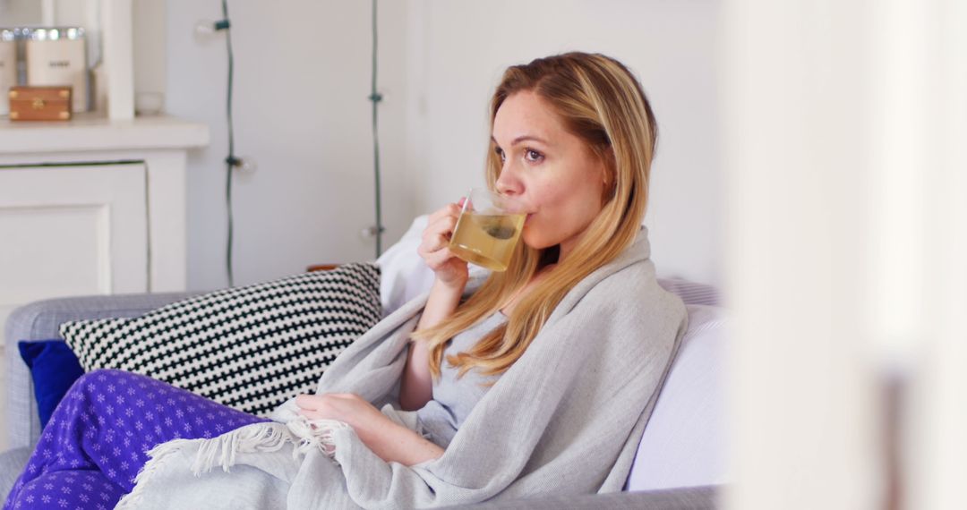 Relaxed Woman Enjoying Herbal Tea at Home - Free Images, Stock Photos and Pictures on Pikwizard.com