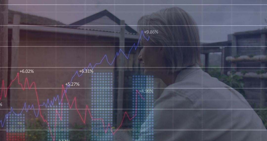 Mature Woman Analyzing Data with Financial Graphics in Residential Setting