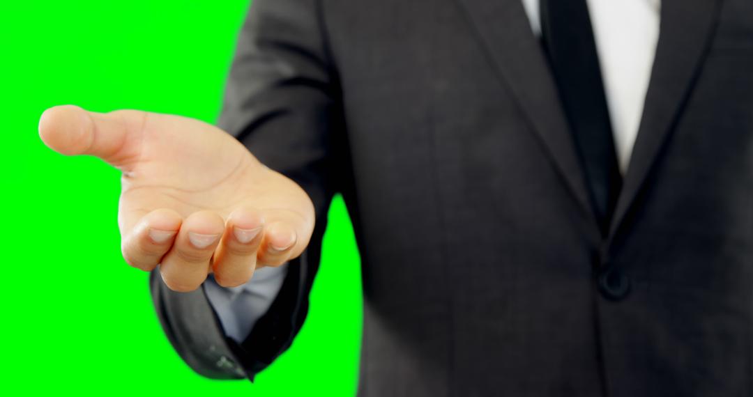 Businessman Reaching Out Hand Gesture on Green Background - Free Images, Stock Photos and Pictures on Pikwizard.com