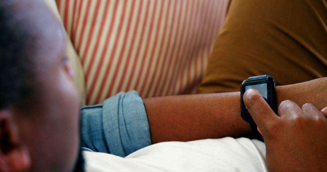 Person Using Smartwatch for Notifications at Home - Free Images, Stock Photos and Pictures on Pikwizard.com