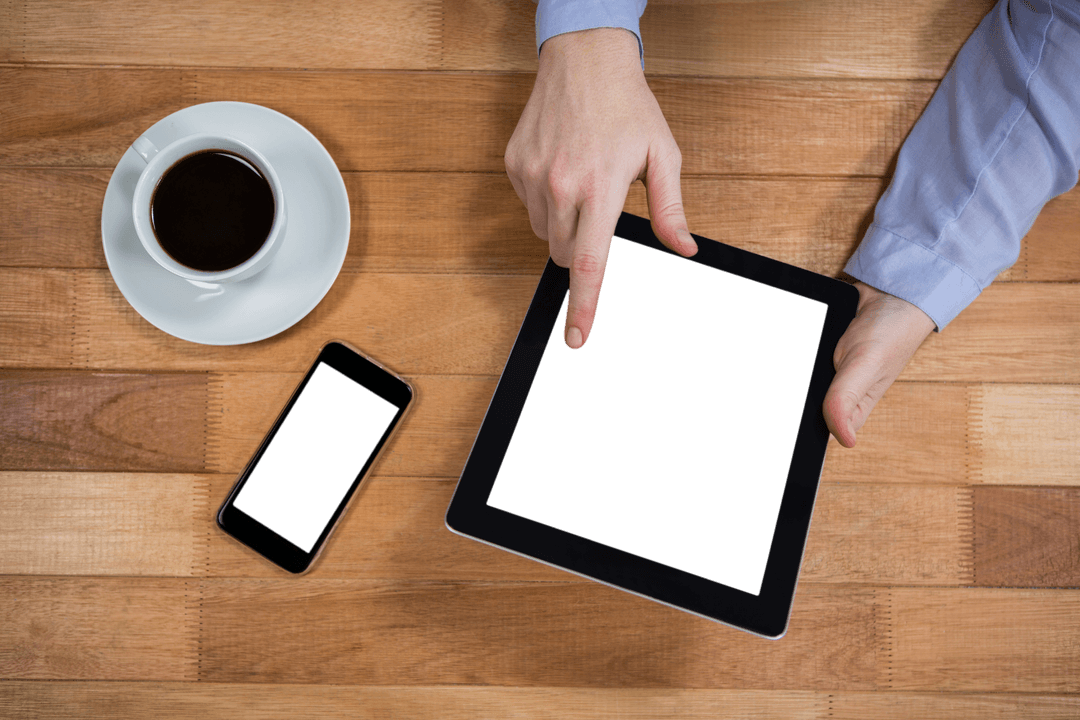 Transparent Screen Tablet on Wooden Office Desk with Coffee
