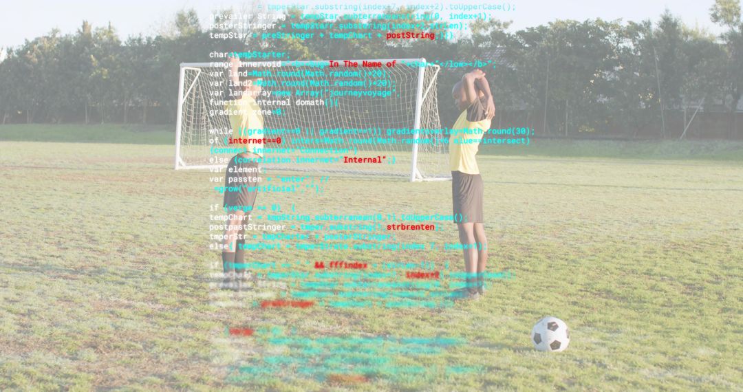 Youth Soccer Teammates Practicing Penalty Kick with Code Overlay Symbolizing Sports Tech