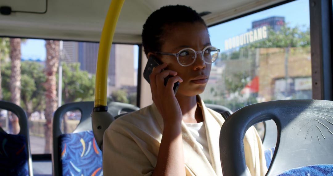 Professional Woman Commuting by Bus Engaged in Phone Call