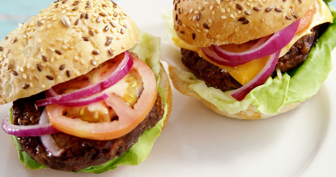 Close-Up of Delicious Juicy Cheeseburgers with Fresh Veggies - Free Images, Stock Photos and Pictures on Pikwizard.com