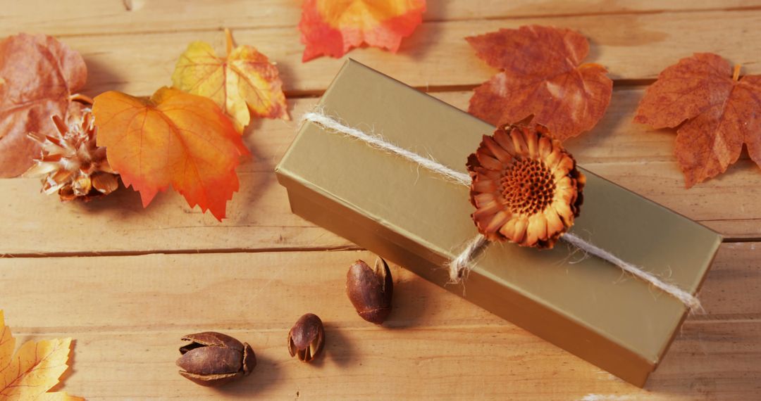 Autumn Gift Box with Dried Flowers and Leaves on Wooden Table - Free Images, Stock Photos and Pictures on Pikwizard.com