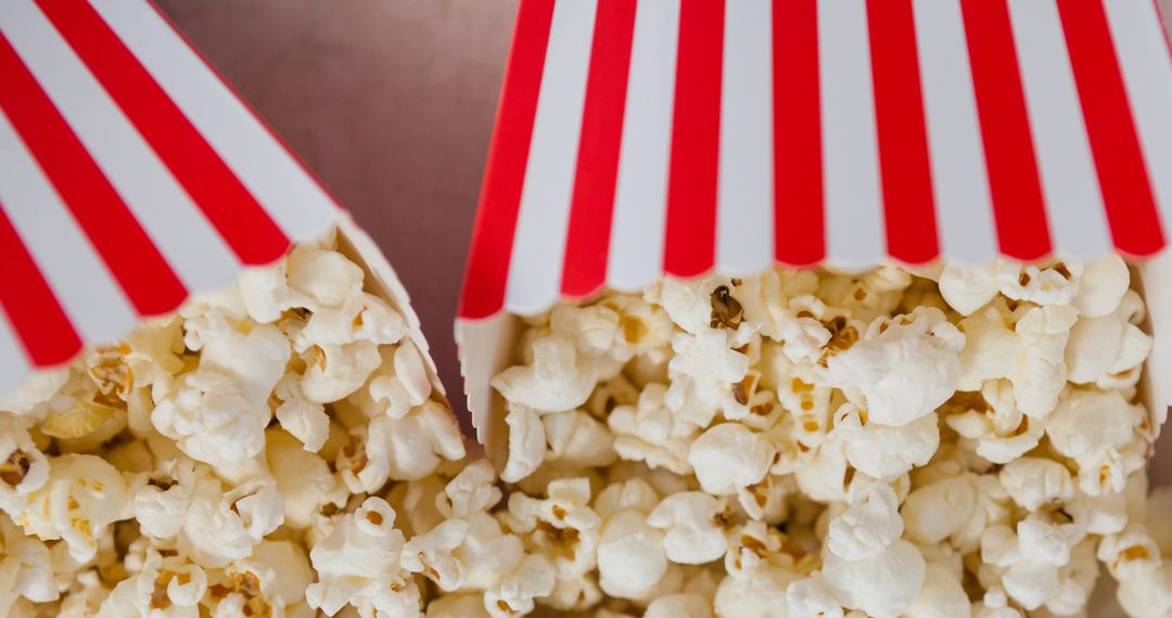 Overflowing Popcorn Buckets on Gray Backdrop - Free Images, Stock Photos and Pictures on Pikwizard.com