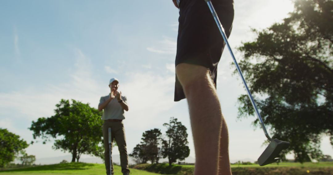Caucasian Man Preparing for Golf Swing on Sunny Course
