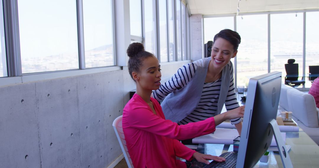 Multi-ethnic Businesswomen Collaborating in Contemporary Office Space