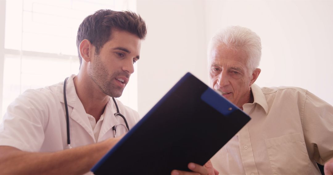 Young Doctor Discussing Diagnosis with Senior Male Patient - Free Images, Stock Photos and Pictures on Pikwizard.com