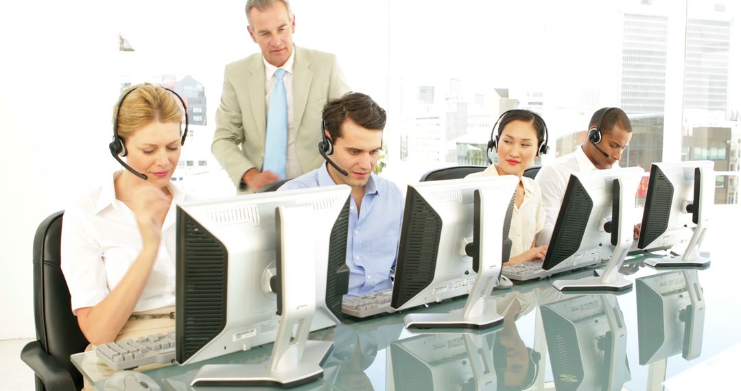 Manager Overseeing Diverse Call Center Team at Work - Free Images, Stock Photos and Pictures on Pikwizard.com