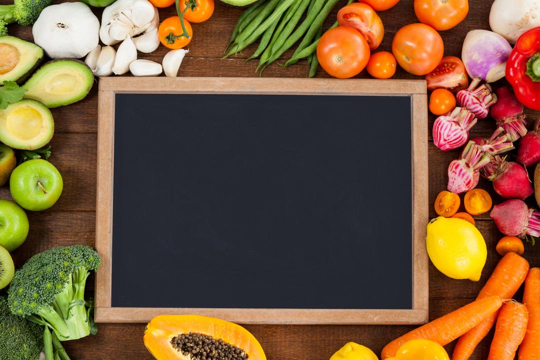 Chalkboard surrounded with fresh vegetables - Free Images, Stock Photos and Pictures on Pikwizard.com