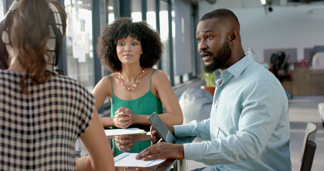 Diverse Team Engaging in Strategic Business Discussion