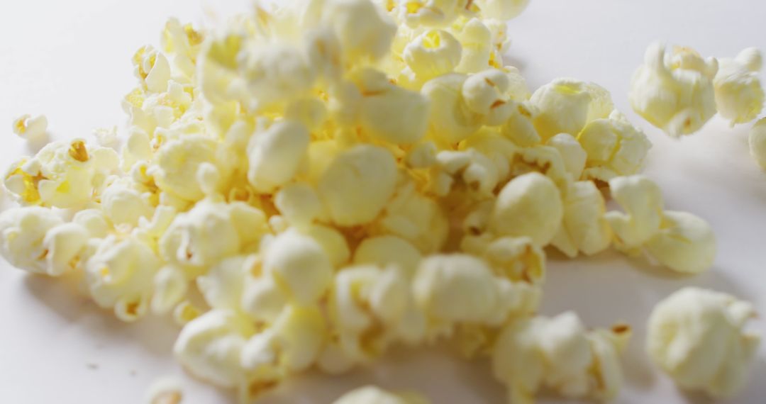 Close-Up View of Fresh Popcorn on White Background - Free Images, Stock Photos and Pictures on Pikwizard.com