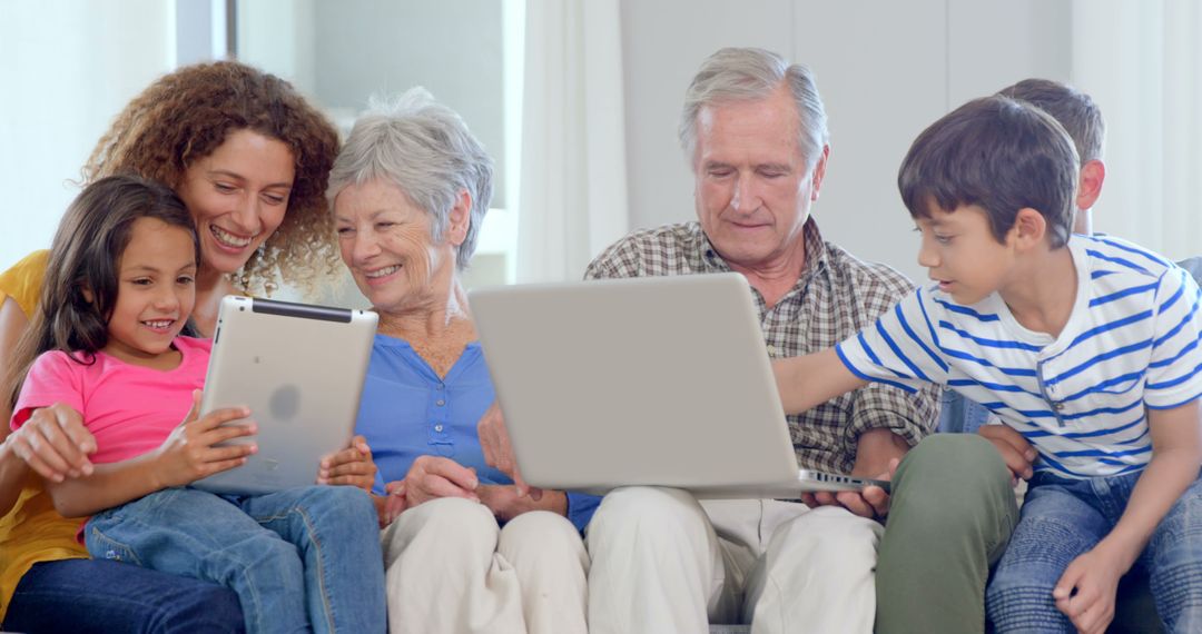 Multi-Generational Family Using Digital Devices at Home - Free Images, Stock Photos and Pictures on Pikwizard.com