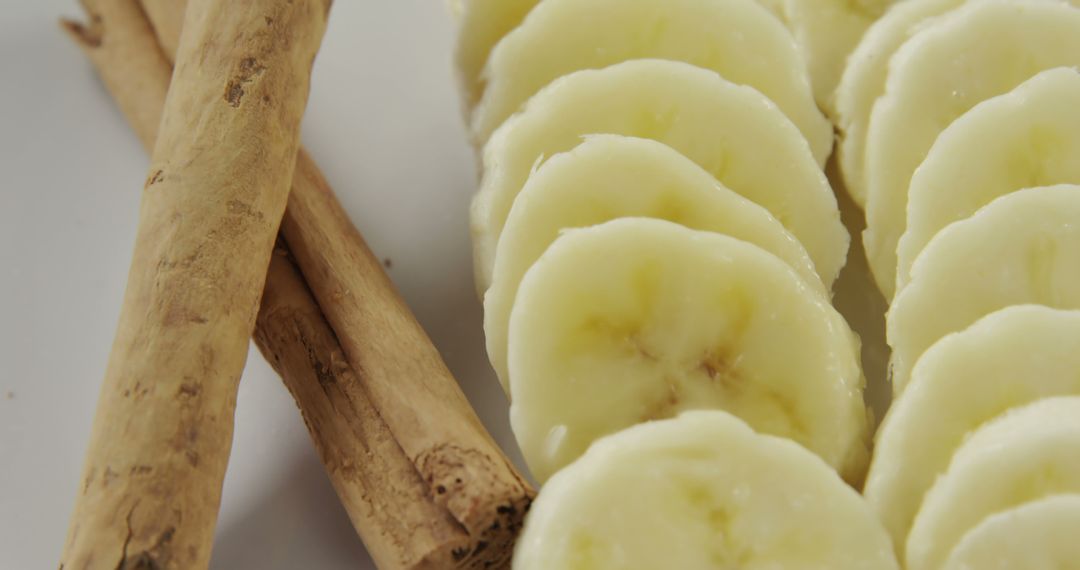 Close-Up of Sliced Bananas with Cinnamon Sticks