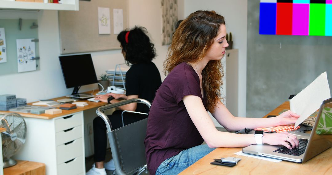 Two Women Working in Creative Office Space - Free Images, Stock Photos and Pictures on Pikwizard.com