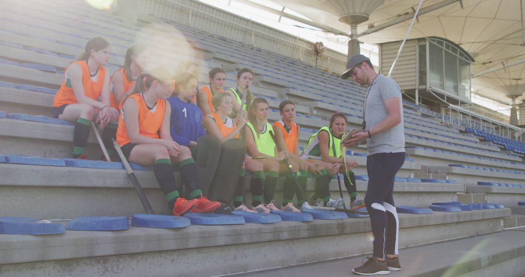 Soccer Coach Giving Instructions to Girls Team During Practice - Free Images, Stock Photos and Pictures on Pikwizard.com