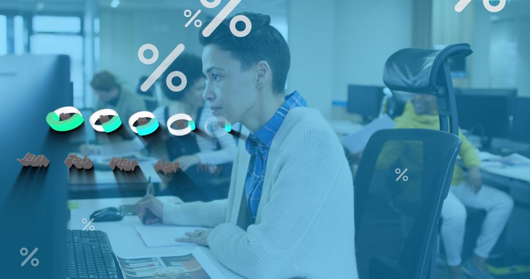 Woman Analyzing Financial Data on Computer in Modern Office