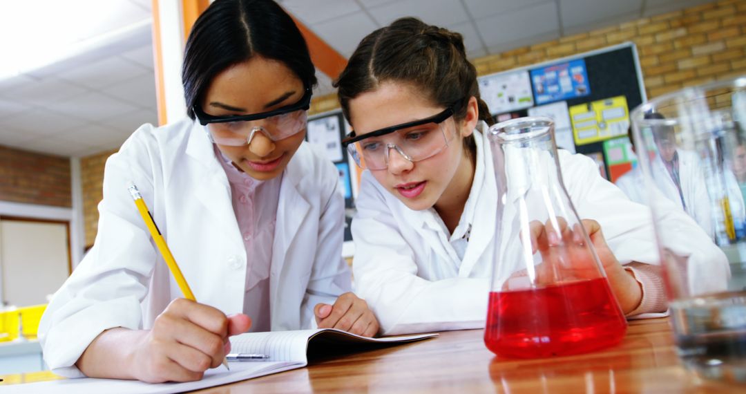 Two Female Scientists Conducting Laboratory Experiment - Free Images, Stock Photos and Pictures on Pikwizard.com