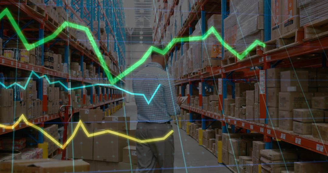 Warehouse Worker Using Scanner Amid Digital Graphs of Inventory Data