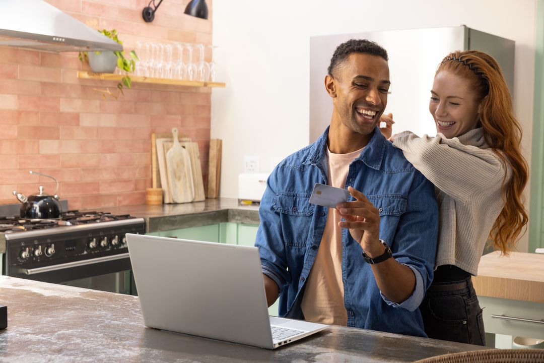 Couple Enjoying Digital Devices in Cozy Kitchen Setting