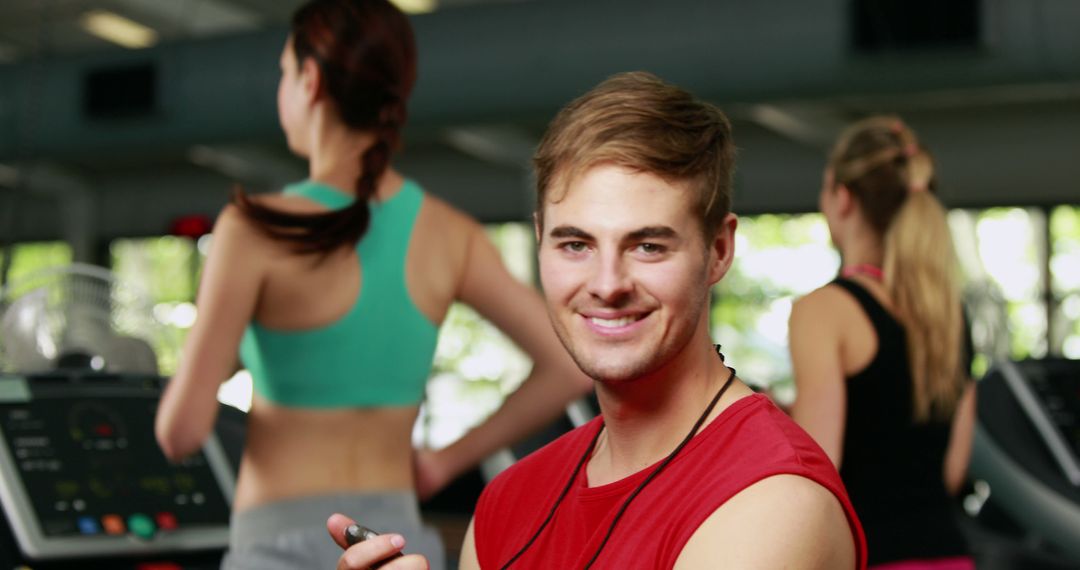 Young Male Personal Trainer Smiling in Gym Full Body Workout Health - Free Images, Stock Photos and Pictures on Pikwizard.com