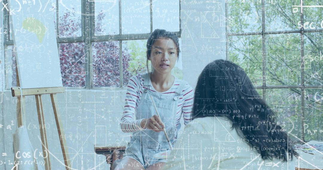 Asian Art Instructor Demonstrating Painting Lesson in Sunlit Studio with Math Overlay