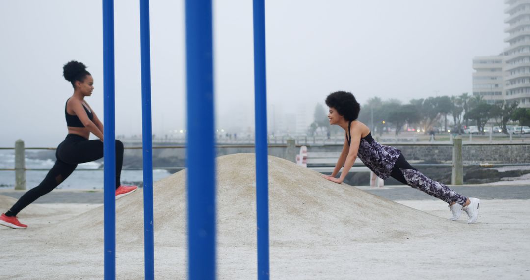 Two Women Exercising Outdoors on a Foggy Morning - Free Images, Stock Photos and Pictures on Pikwizard.com