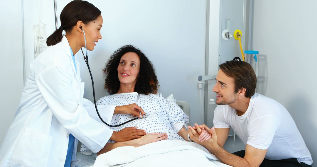 Pregnant Woman with Caring Partner Getting Prenatal Checkup by Doctor - Free Images, Stock Photos and Pictures on Pikwizard.com