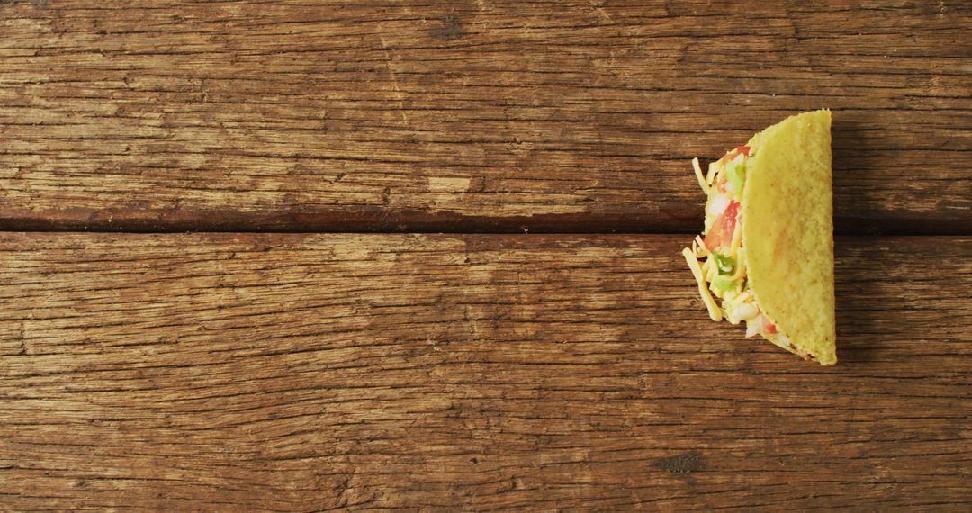 Delicious Half Taco on Rustic Wooden Table - Free Images, Stock Photos and Pictures on Pikwizard.com