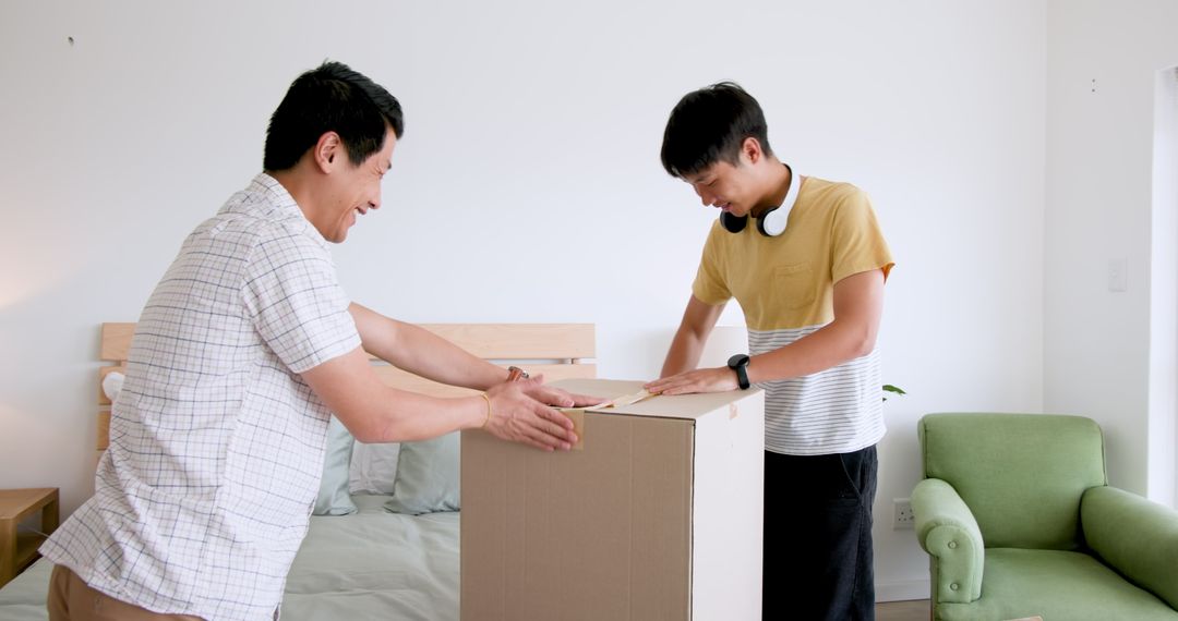 Father and Son Packing Box with Teamwork and Smiles