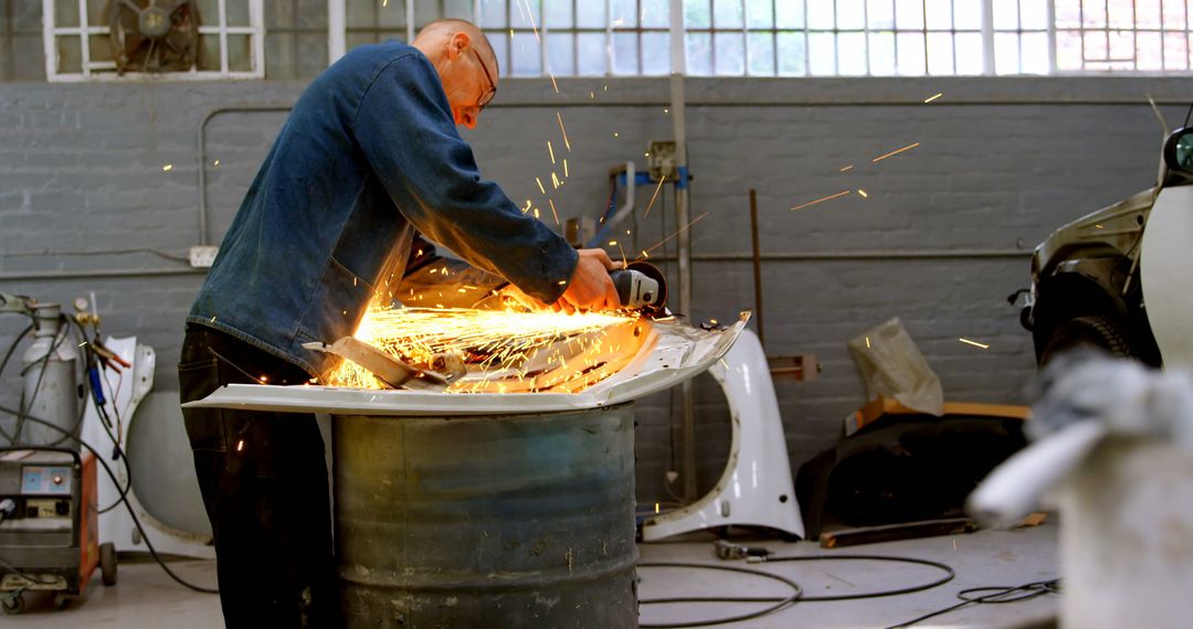 Metalworker Using Angle Grinder in Workshop Creating Sparks - Free Images, Stock Photos and Pictures on Pikwizard.com