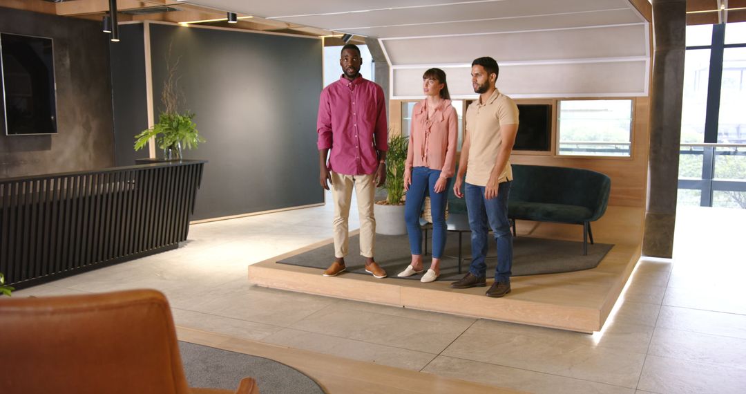 Diverse Team Discussing Work in Modern Corporate Office