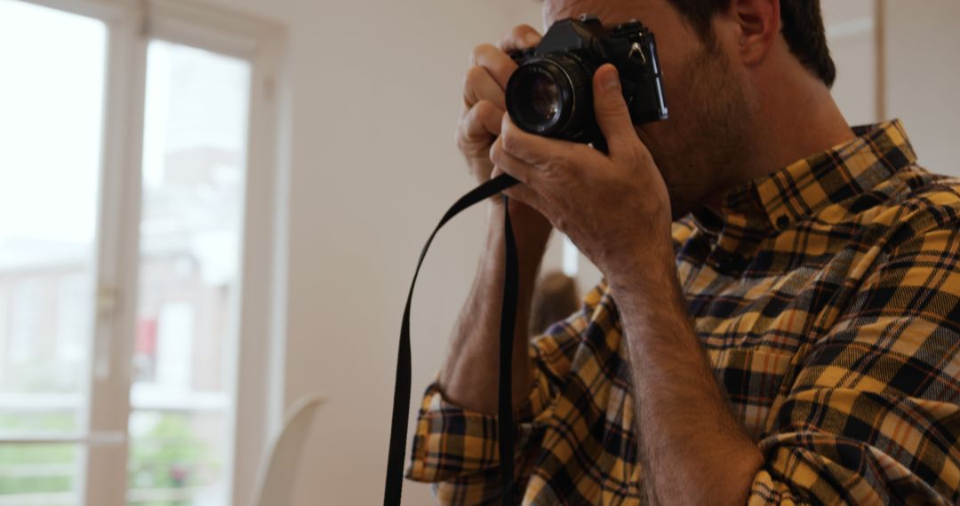 Caucasian Man Posing with Vintage Camera - Free Images, Stock Photos and Pictures on Pikwizard.com