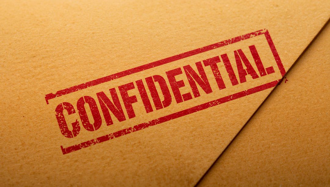 Confidential Stamp on Sealed Kraft Envelope with Red Ink and Textured Paper Flap