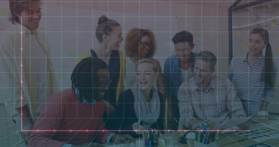 Creative team collaborating on design layouts around table with laptop and color swatches