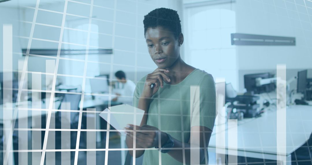 Woman Analyzing Financial Data in Modern Office Environment
