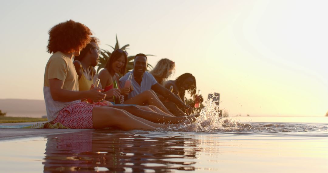 Diverse Group of Friends Relaxing Poolside at Sunset - Free Images, Stock Photos and Pictures on Pikwizard.com