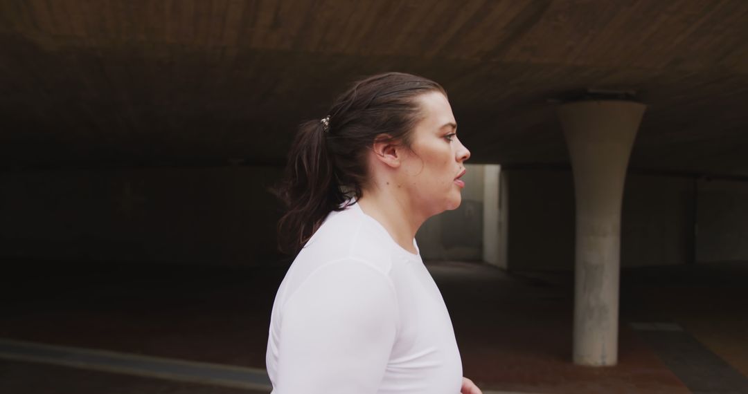 Determined Woman Jogging in Urban Environment - Free Images, Stock Photos and Pictures on Pikwizard.com