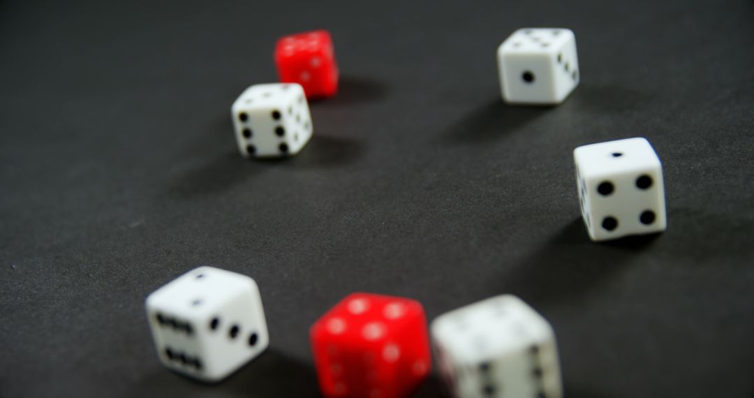 Scattered Red and White Dice on Dark Background - Free Images, Stock Photos and Pictures on Pikwizard.com