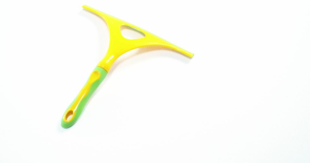 Bright yellow and green squeegee isolated on white background - Free Images, Stock Photos and Pictures on Pikwizard.com