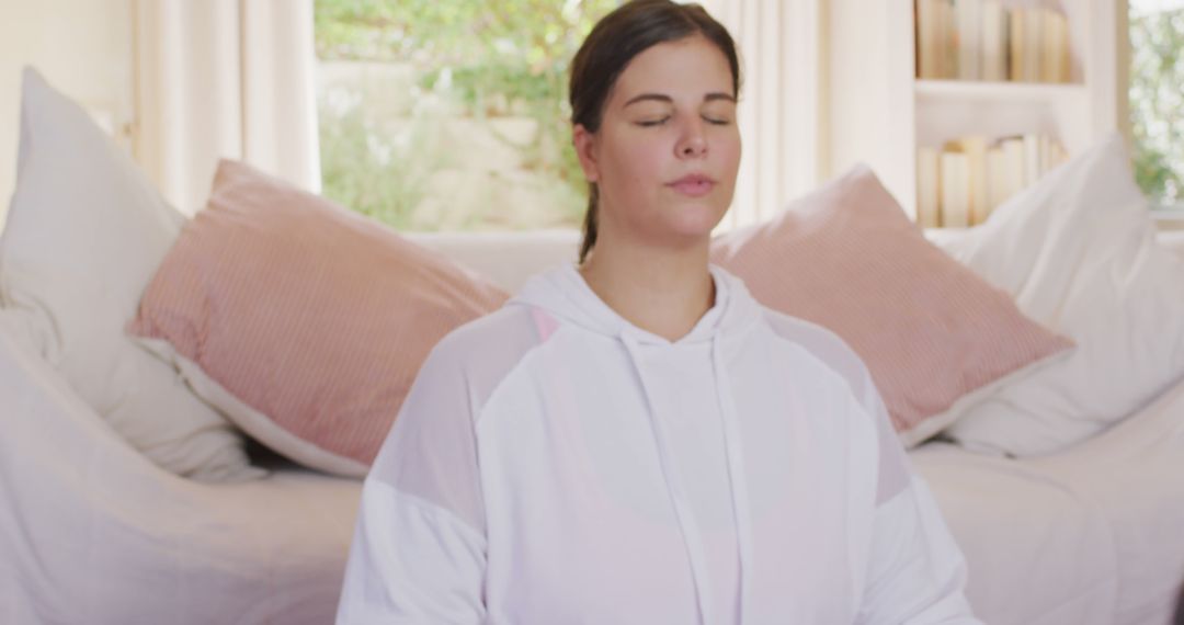 Woman Practicing Meditation at Home in Comfortable Clothing - Free Images, Stock Photos and Pictures on Pikwizard.com