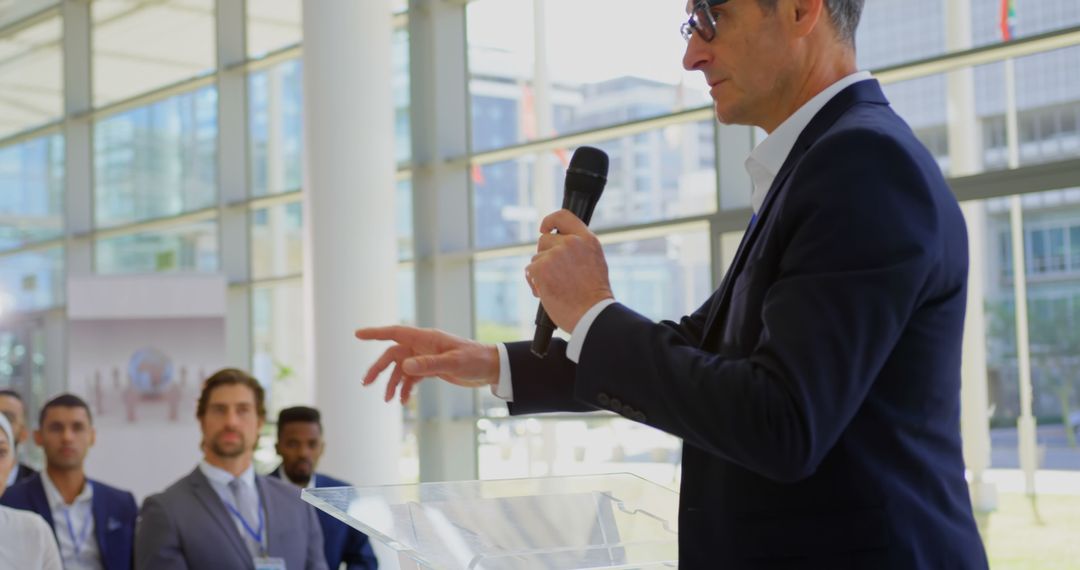 Business Professional Speaking at Corporate Seminar