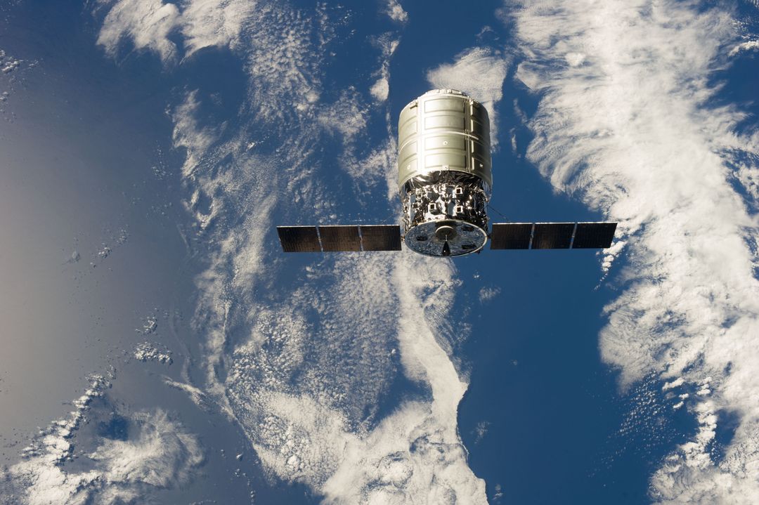First Cygnus Commercial Cargo Ship Docking with International Space Station, 2013 - Free Images, Stock Photos and Pictures on Pikwizard.com