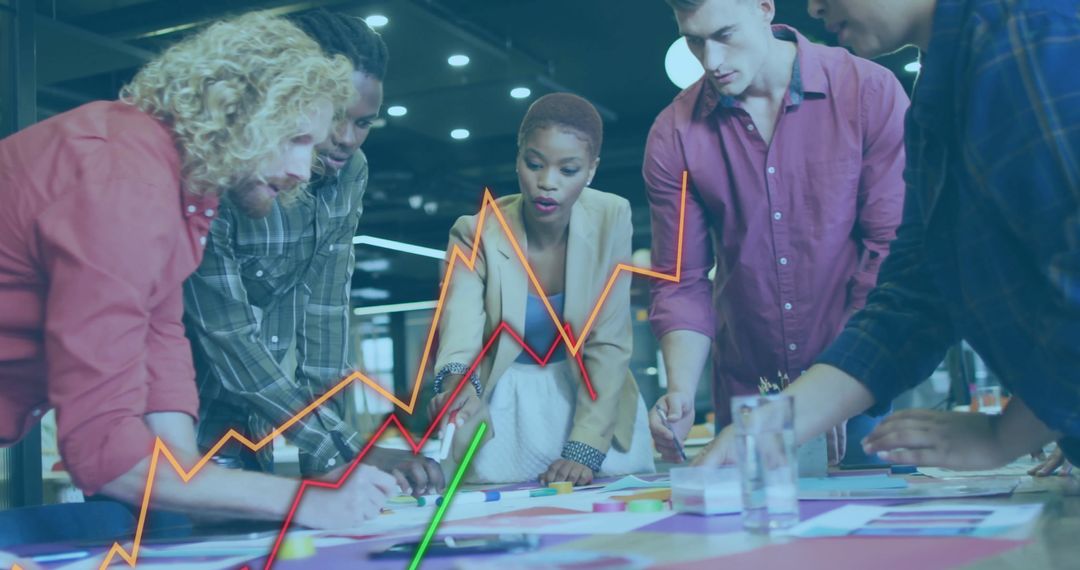 Diverse Team Strategizing with Data Visualization in Modern Office