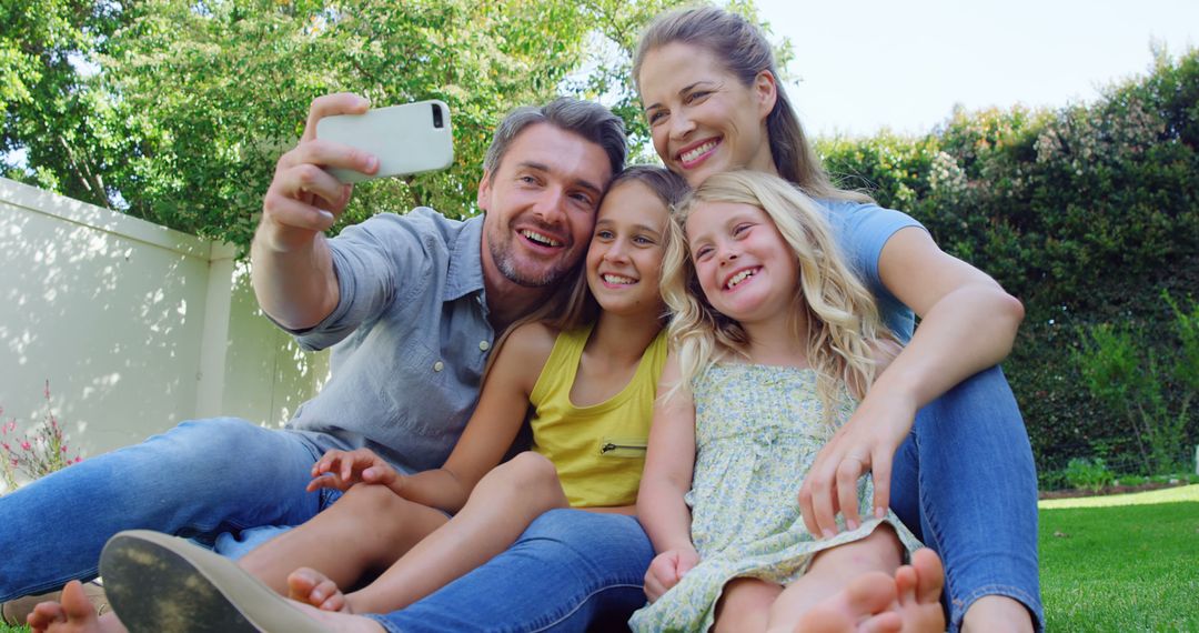 Smiling Family Taking Selfie in Backyard on Sunny Day - Free Images, Stock Photos and Pictures on Pikwizard.com