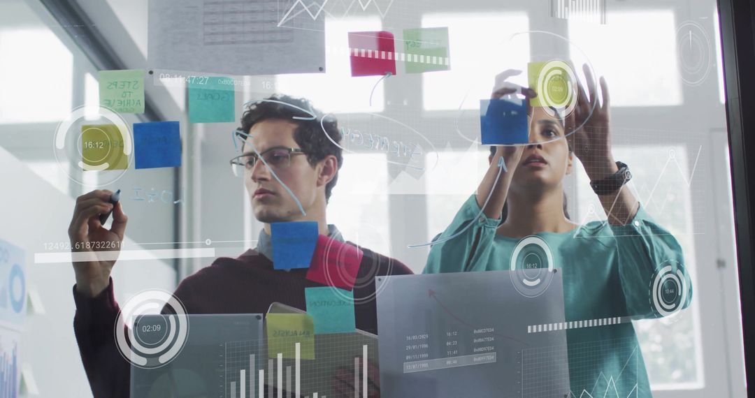 Innovative Professionals Analyzing Data on Transparent Screen