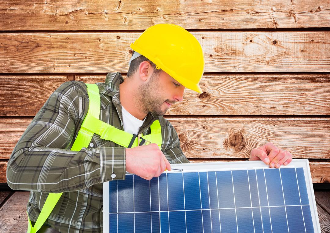 Worker fixing solar panel against wooden background - Free Images, Stock Photos and Pictures on Pikwizard.com