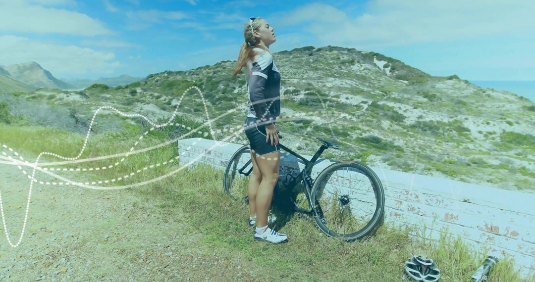 Cyclist Taking Break on Scenic Coastal Trail