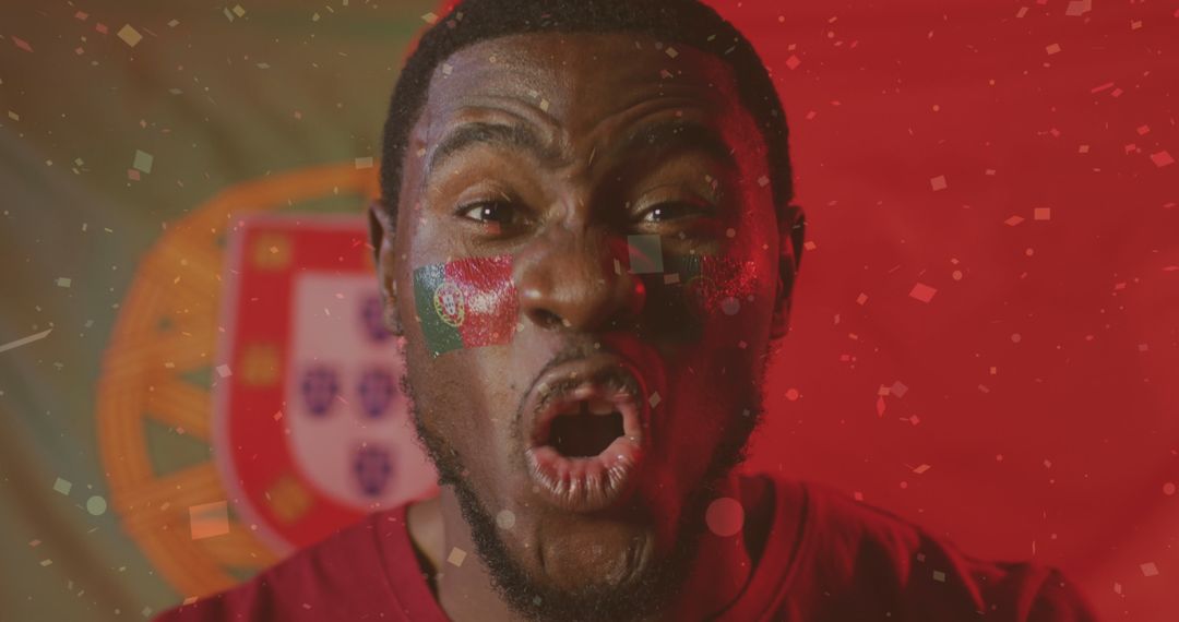 Excited Sports Fan Cheering in Front of Portuguese Flag - Free Images, Stock Photos and Pictures on Pikwizard.com